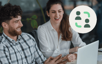 Manager and agent collaborating at laptop with team icon overlay