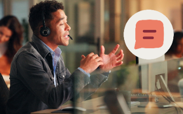 Contact center agent on headset engaged in conversation with chat icon