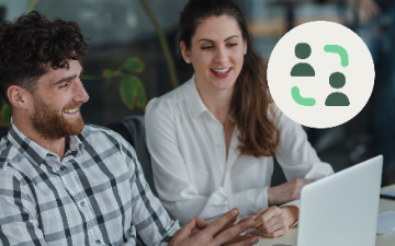Manager and agent collaborating at laptop with team icon overlay